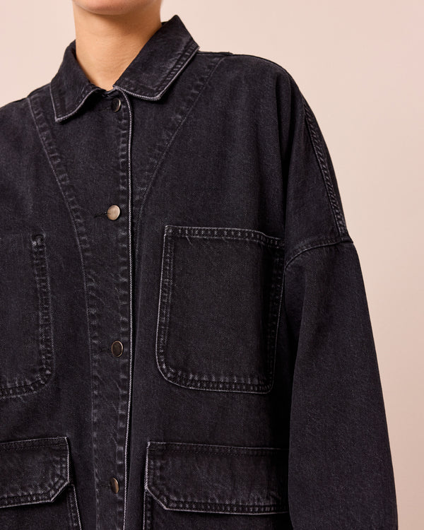 model wears bea washed black denim jacket