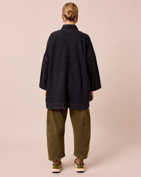 model wears bea washed black denim jacket