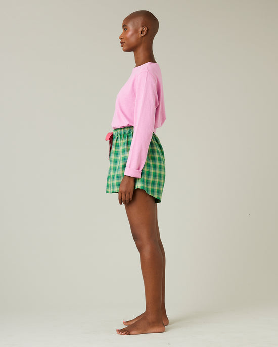 model wears green multi check bed shorts