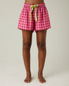 model wears pink and red check bed shorts