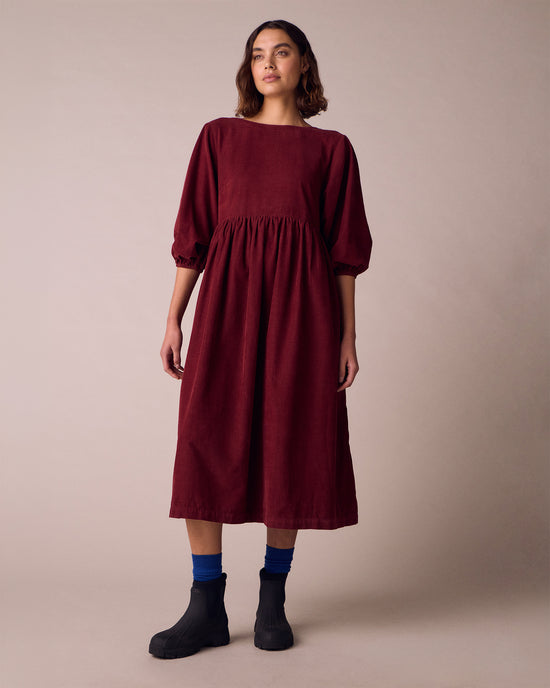model wears berlin garnet cord dress