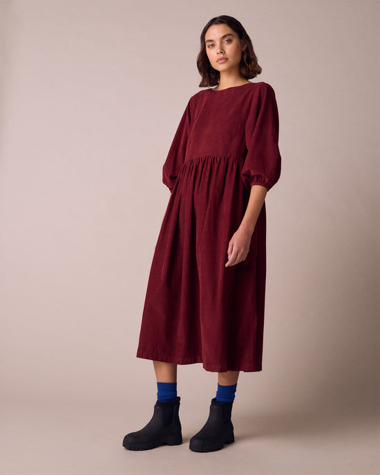 model wears berlin garnet cord dress