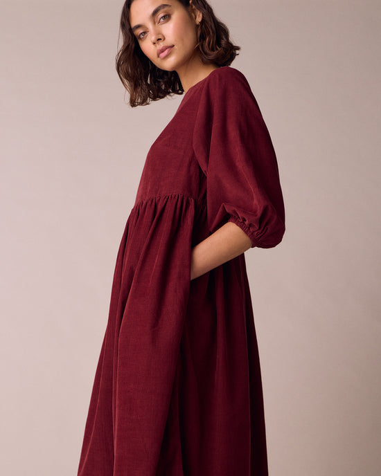 model wears berlin garnet cord dress