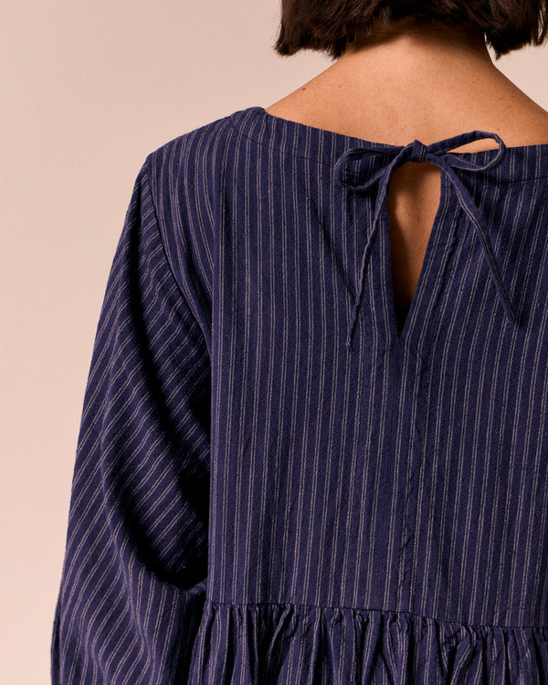 model wears berlin midnight pinstripe cotton dress