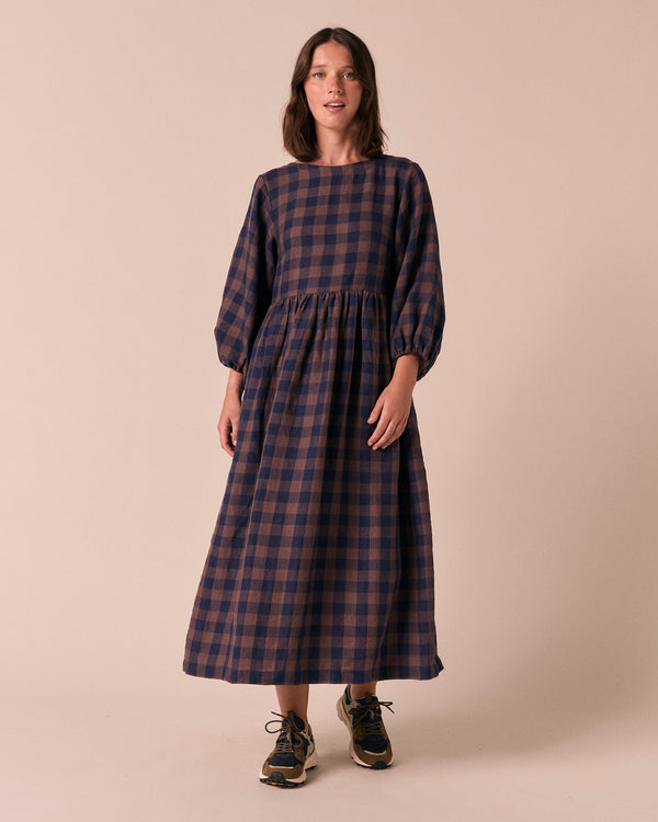 model wears berlin cedar check linen dress