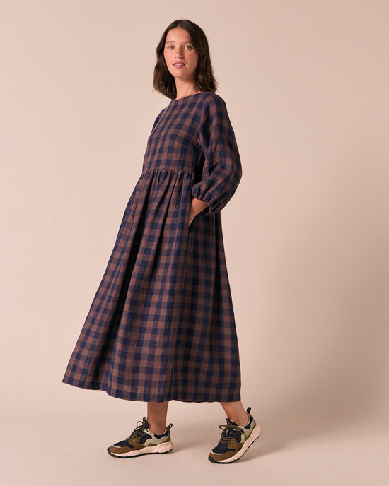 model wears berlin cedar check linen dress