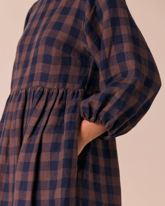model wears berlin cedar check linen dress
