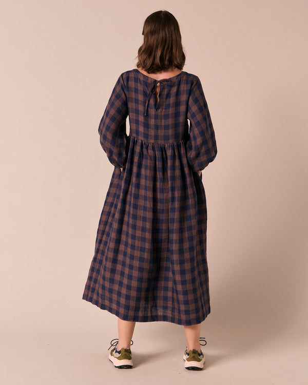 model wears berlin cedar check linen dress