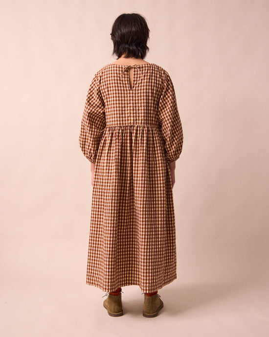 model wears berlin tan seersucker dress