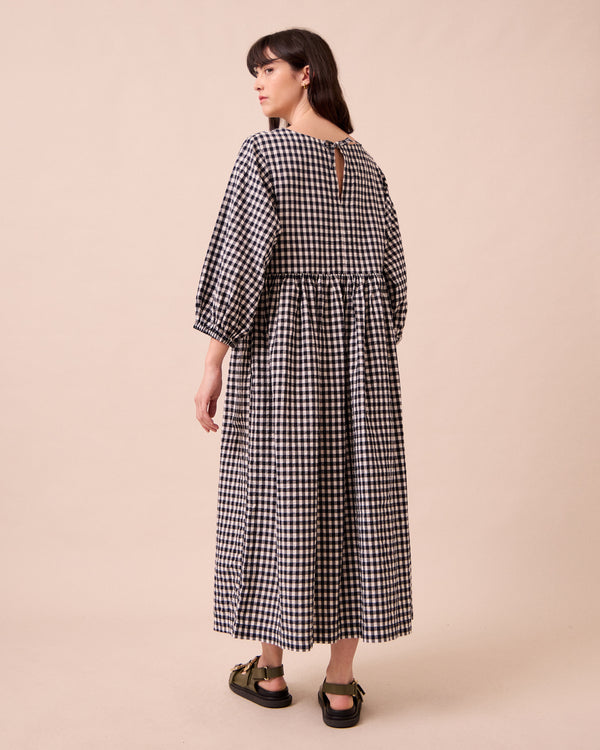 model wears berlin black and ecru gingham seersucker dress