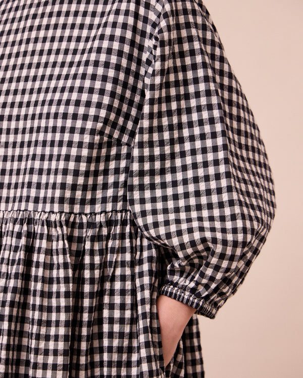 model wears berlin black and ecru gingham seersucker dress
