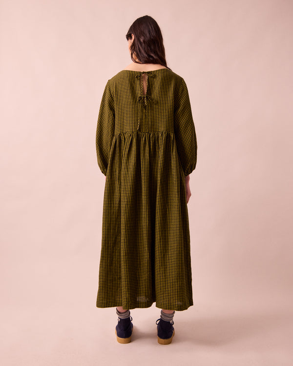 model wears berlin fresh olive mini gingham linen dress