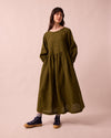 model wears berlin fresh olive mini gingham linen dress