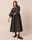 model wears berlin black and ecru pencil stripe linen dress