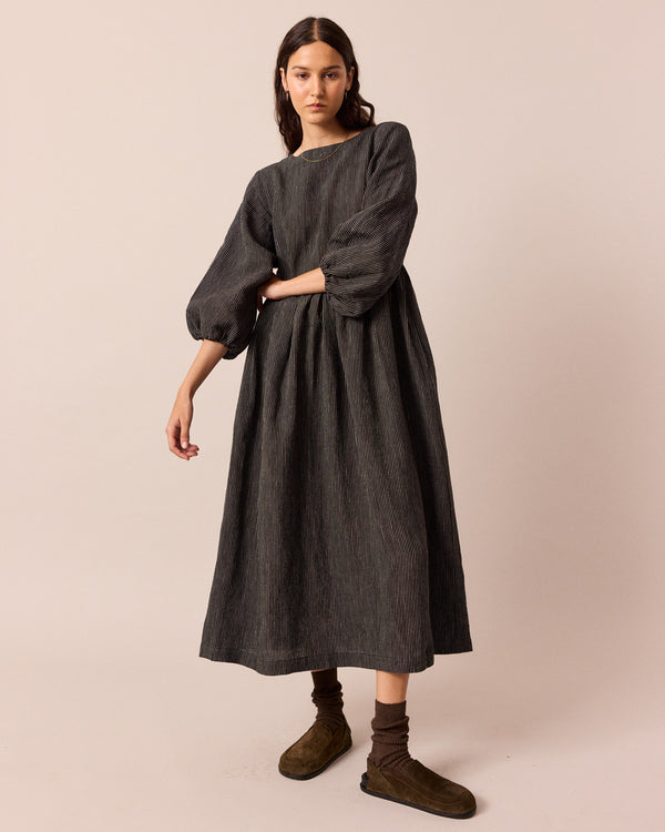 model wears berlin black and ecru pencil stripe linen dress
