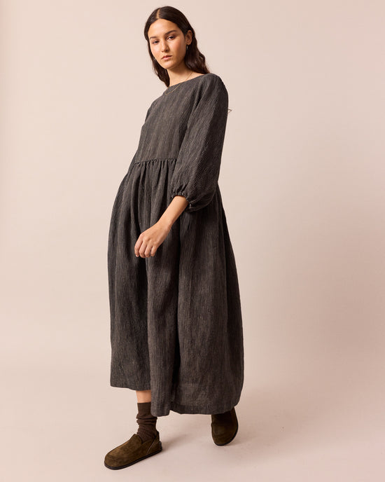 model wears berlin black and ecru pencil stripe linen dress