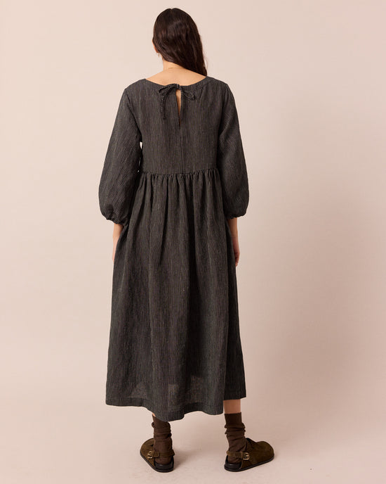 model wears berlin black and ecru pencil stripe linen dress