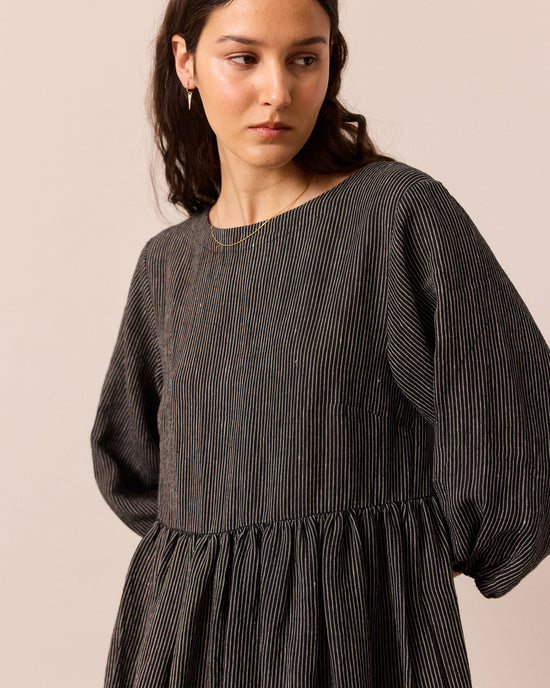 model wears berlin black and ecru pencil stripe linen dress