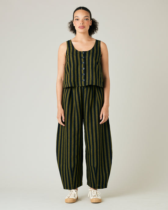 model wears black and olive stripe daisy trousers