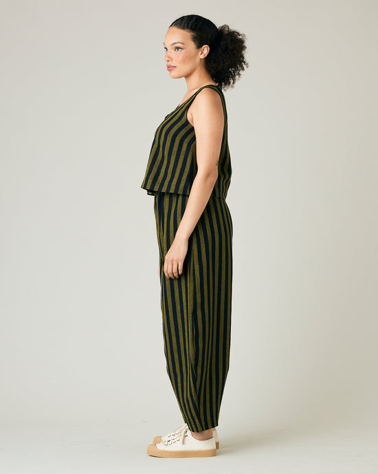 model wears black and olive stripe daisy trousers