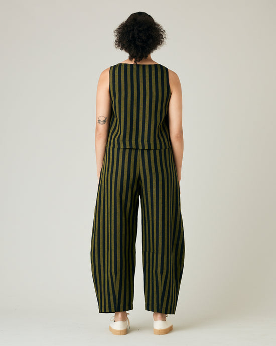 model wears black and olive stripe daisy trousers