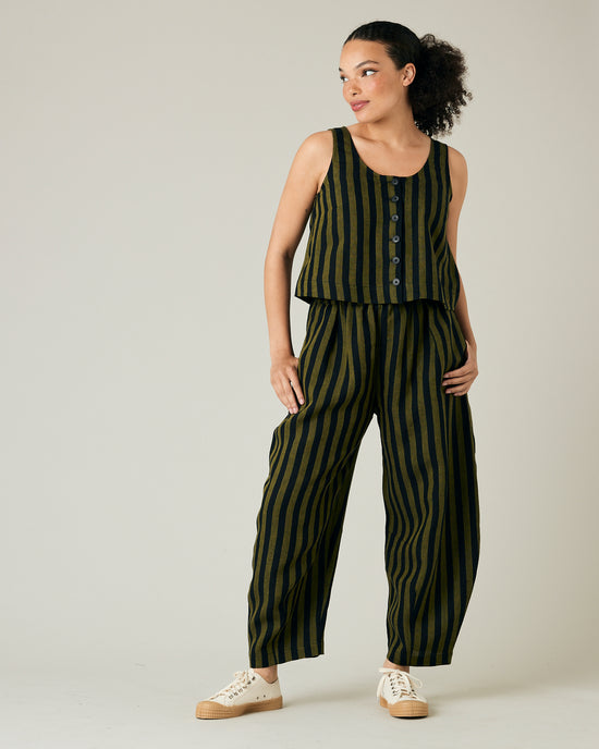 model wears black and olive stripe daisy trousers