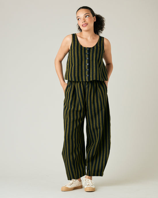 model wears black and olive stripe daisy trousers