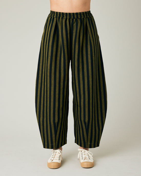 model wears black and olive stripe daisy trousers front