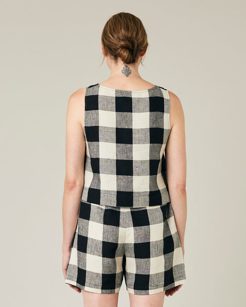 model wears stone and black mega check betty top