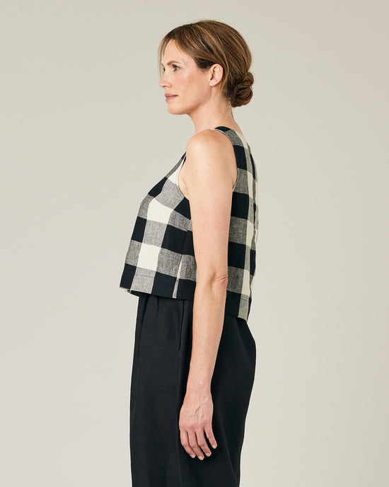 model wears stone and black mega check betty top