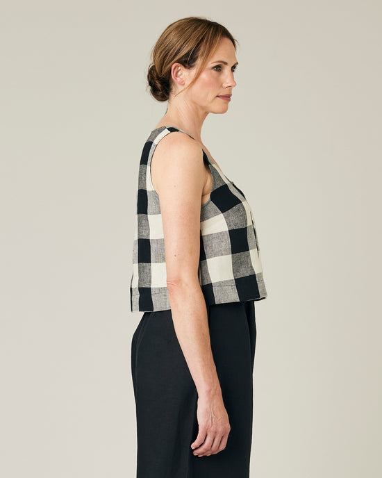 model wears stone and black mega check betty top