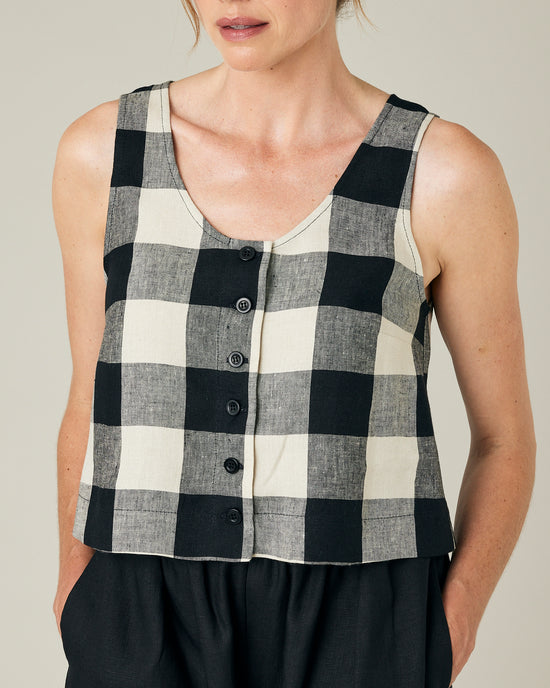 model wears stone and black mega check betty top