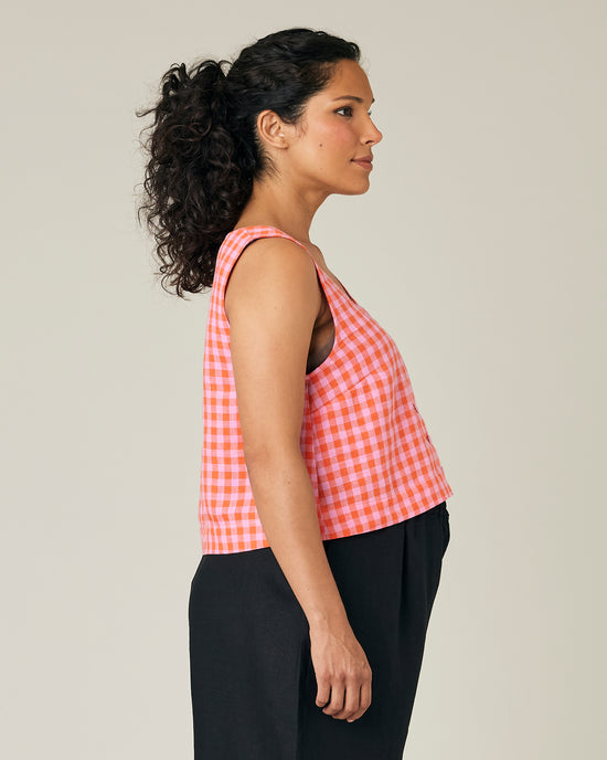 pregnant model wears pink and tomato check betty top