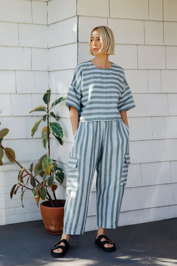 model wears jodi aloe stripe linen trousers