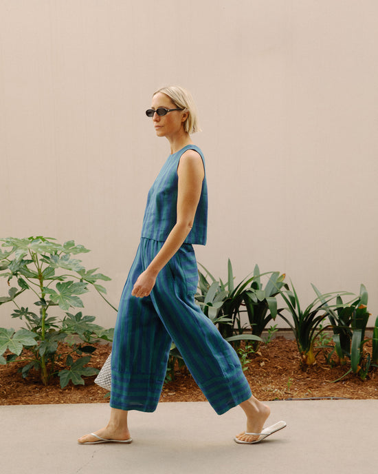 model wears bobbi house blue linen trousers