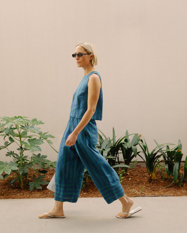 model wears bobbi house blue linen trousers