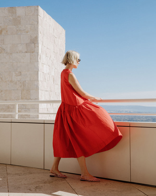 model wears chilli red cotton linen dress
