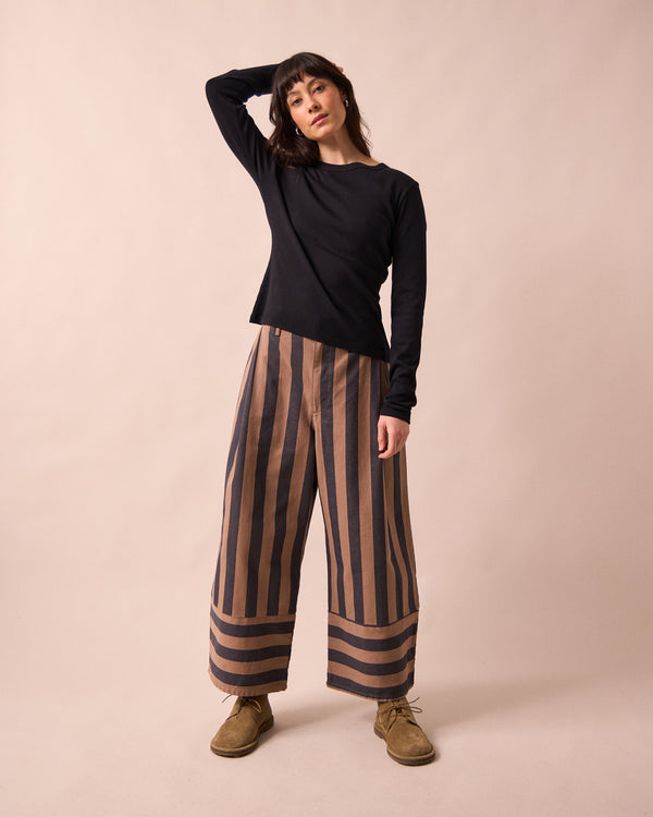 model wears blair graphite and mocha denim jeans right