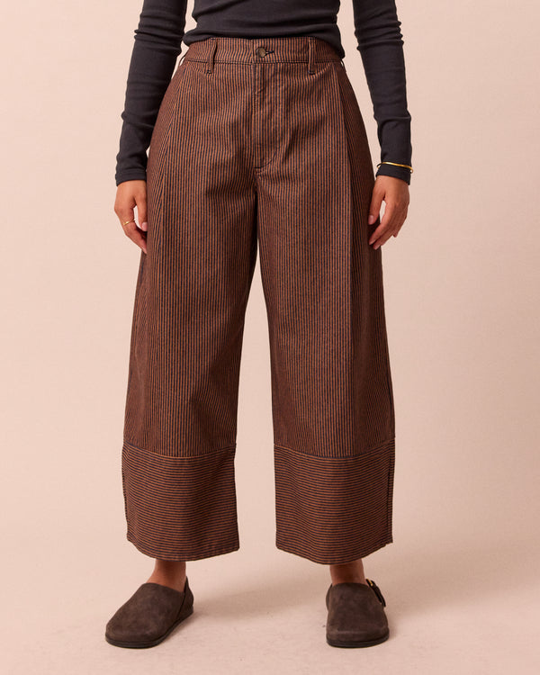 model wears blair hickory rust stripe denim jeans front