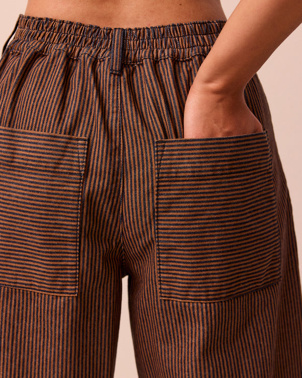 model wears blair hickory rust stripe denim jeans