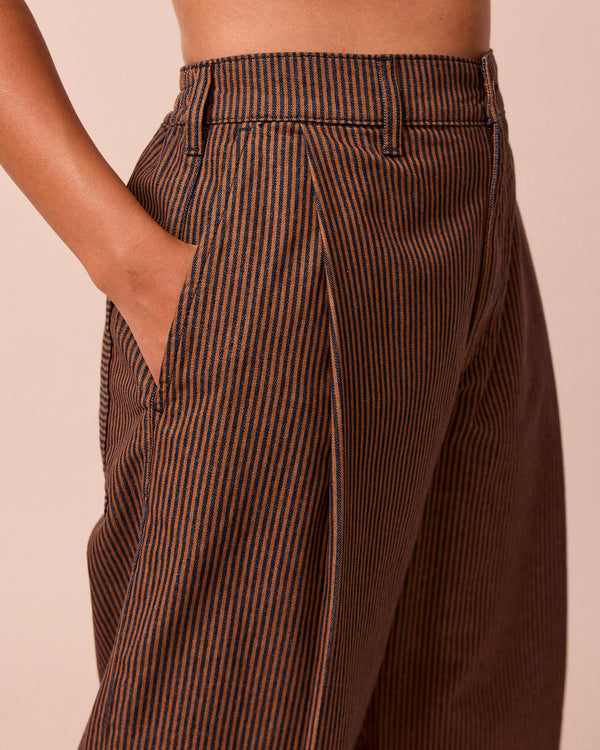 model wears blair hickory rust stripe denim jeans