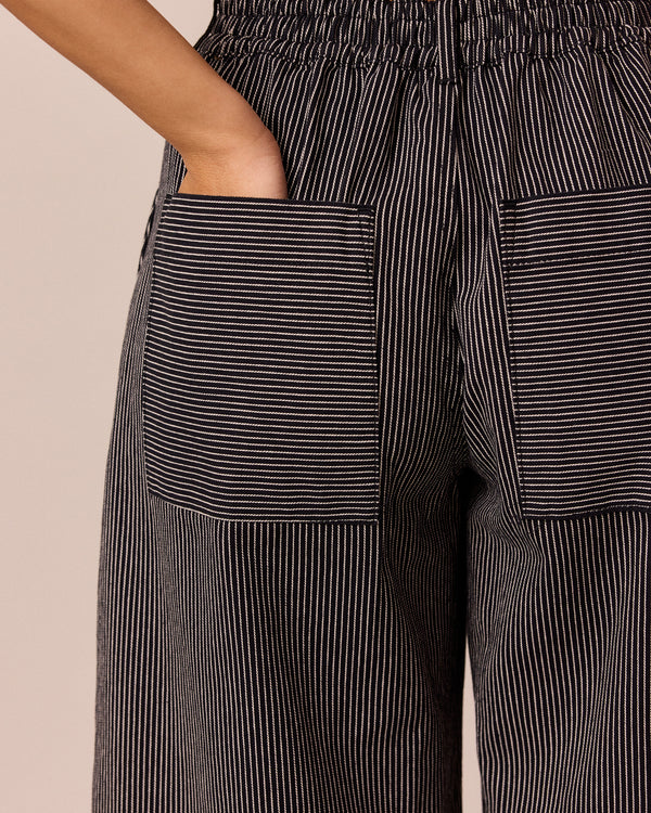 model wears blair black hickory stripe denim jeans