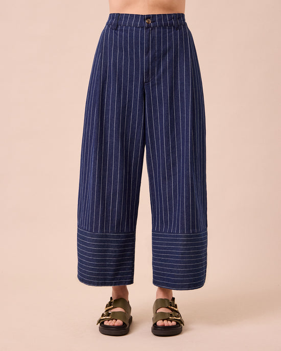 model wears blair mid blue pinstripe denim jeans front