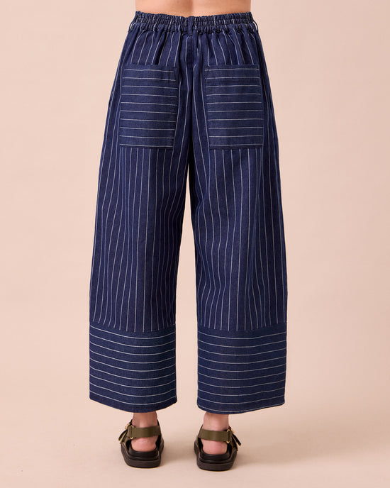 model wears blair mid blue pinstripe denim jeans back