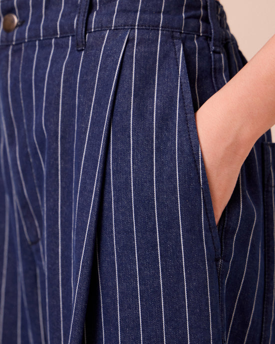 model wears blair mid blue pinstripe denim jeans 