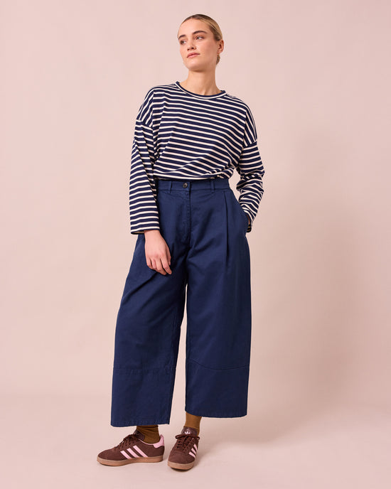 model wears blair ink denim jeans left