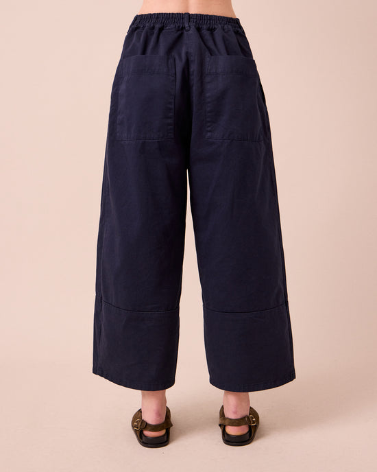 model wears blair ink twill trousers back