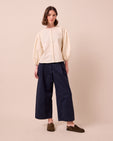 model wears blair ink twill trousers left