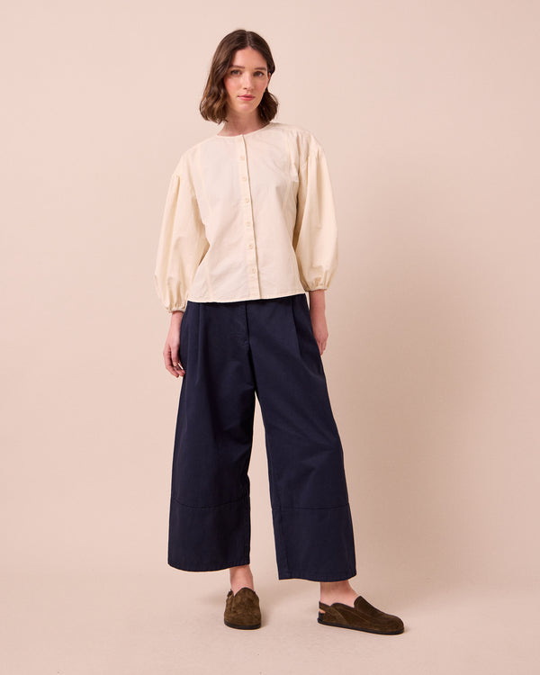 model wears blair ink twill trousers left