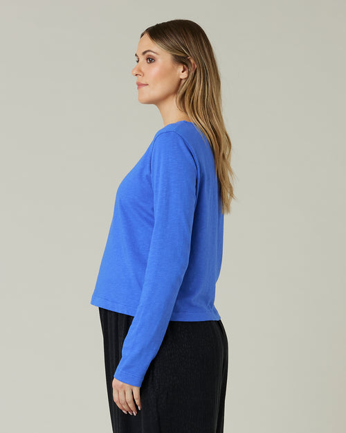 pregnant model wears lapis blue boat neck top